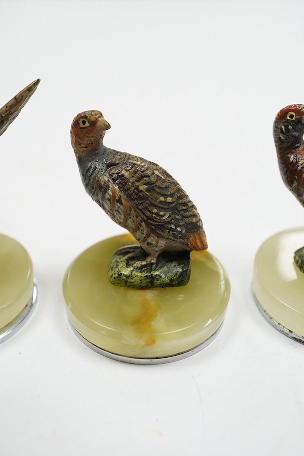 A cased Asprey set of four cold painted bronze and chrome plated novelty game bird menu holders, tallest 5cm high. Condition - good